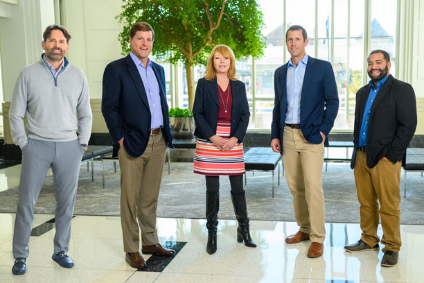 Carlino Commercial Development team standing in a lobby